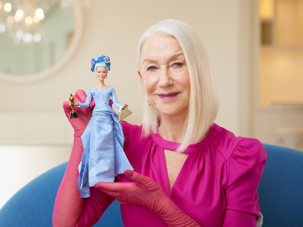 Dame Helen poses with her new Barbie doll. (Mattel)