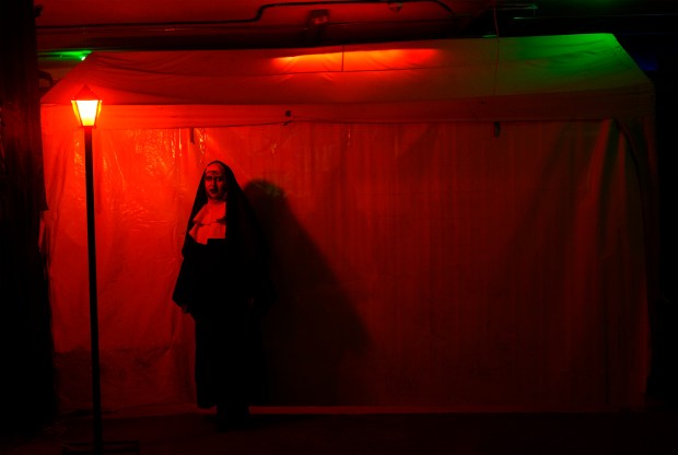 A woman dressed as the "Ghost nun from Sucre" performs at a House of Terror during a Day of the Dead night in La Paz, Bolivia, Tuesday, Oct. 31, 2023. People, mostly of Aymara descent, have started to embrace Halloween celebrations introducing characters adapted from their own culture. (AP Photo/Juan Karita)