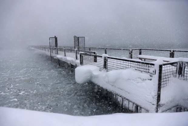 Snow continues to fall on the shores of Lake Tahoe in Tahoe City, Calif., on Saturday, March 2, 2024. (Jane Tyska/Bay Area News Group via AP)