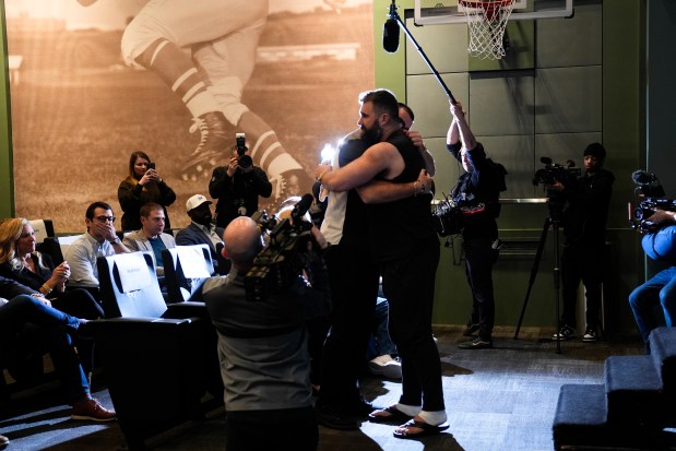 Philadelphia Eagles' Jason Kelce embraces his brother, Kansas City Chiefs' Travis Kelce, after an NFL football press conference announcing his retirement in Philadelphia, Monday, March 4, 2024. (AP Photo/Matt Rourke)