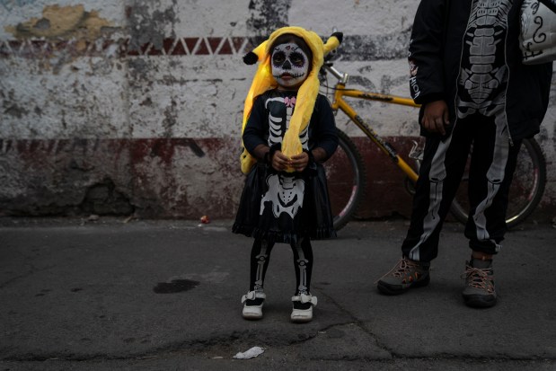 MEXICO CITY, MEXICO - NOVEMBER 1: A girl dressed in a Halloween costume poses for a portrait during 'Day of the Dead' celebrations on November 1, 2023 in Mexico City, Mexico. The Day of the Dead takes place every year on November 1 and 2. The celebration is one of the most colorful and popular in the country bringing millions of tourists to witness how people set offerings, decorate homes and cemeteries and organize family gatherings as a tribute to the dead. (Photo by Toya Sarno Jordan/Getty Images)