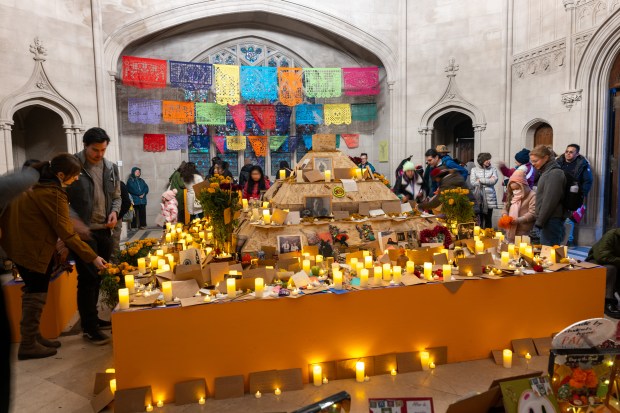 NEW YORK, NEW YORK - NOVEMBER 01: People visit a chapel with candles and remembrances of the deceased on the grounds of Greenwood Cemetery during a celebration of Día de los Muertos (Day of the Dead) in Brooklyn on November 01, 2023 in New York City. The holiday, which is celebrated throughout Latin America from October 31st to November 2nd, is used as a time for family and friends to commemorate departed loved ones through dance, music, prayer, and altars. Greenwood Cemetery, which is a national historic landmark, holds and annual day long celebration of Día de los Muertos for the community, many of whom have arrived to Brooklyn from parts of Latin America. (Photo by Spencer Platt/Getty Images)