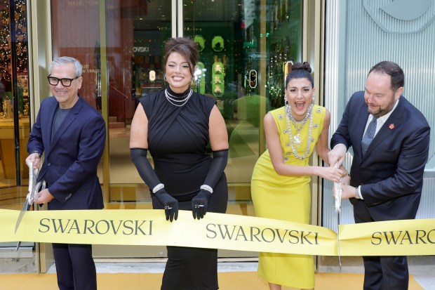 NEW YORK, NEW YORK - DECEMBER 06: Swarovski CEO Alexis Nasard (2nd L), Ashley Graham (C), and Swarovski Global Creative Director Giovanna Battaglia Engelbert (2nd R) prepare cut the ribbon in front of the Swarovski On Fifth store during the Opening Ceremony on December 06, 2023 in New York City. (Photo by Michael Loccisano/Getty Images)