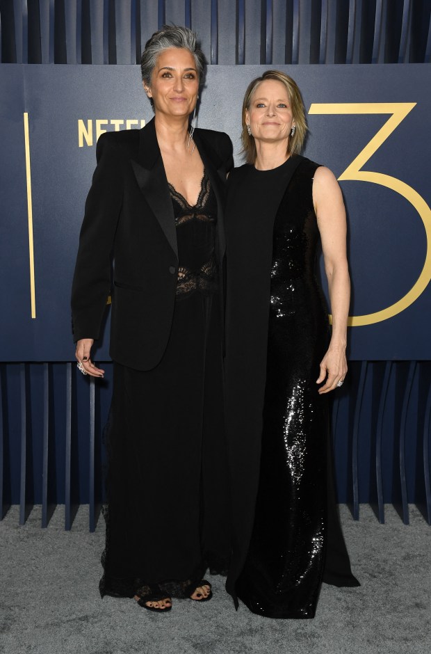 US actress and filmmaker Jodie Foster and her wife director Alexandra Hedison arrive for the 30th Annual Screen Actors Guild awards at the Shrine Auditorium in Los Angeles, February 24, 2024. (Photo by VALERIE MACON / AFP) (Photo by VALERIE MACON/AFP via Getty Images)