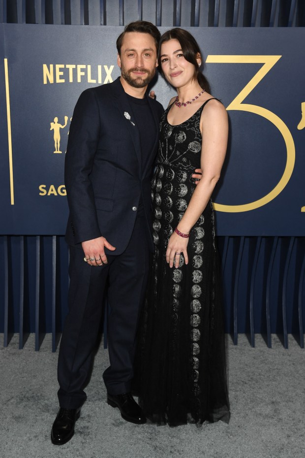 (From L) US actor Kieran Culkin and wife Jazz Charton arrive for the 30th Annual Screen Actors Guild awards at the Shrine Auditorium in Los Angeles, February 24, 2024. (Photo by VALERIE MACON / AFP) (Photo by VALERIE MACON/AFP via Getty Images)