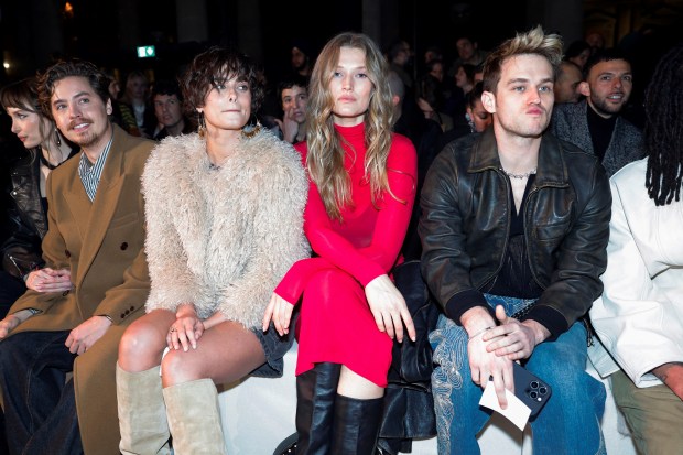 (From L) Model Ari Fournier, US actor Cole Sprouse, US model Taylor Hill, German model Toni Garrn and US actor Brandon Flynn sit ahead of the presentation of creations by Isabel Marant for the Women Ready-to-wear Fall-Winter 2024/2025 collection as part of the Paris Fashion Week, in Paris on February 29, 2024. (Photo by Geoffroy VAN DER HASSELT / AFP) (Photo by GEOFFROY VAN DER HASSELT/AFP via Getty Images)