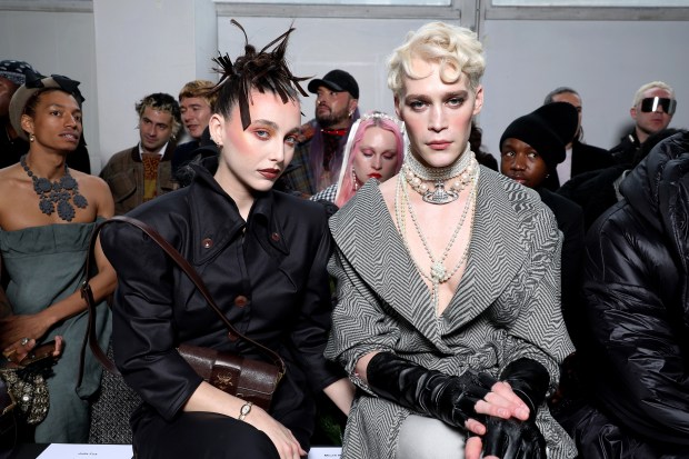 PARIS, FRANCE - MARCH 02: (EDITORIAL USE ONLY - For Non-Editorial use please seek approval from Fashion House) Emma Chamberlain and Micah McLaurin attend the Vivienne Westwood Womenswear Fall/Winter 2024-2025 show as part of Paris Fashion Week on March 02, 2024 in Paris, France. (Photo by Pascal Le Segretain/Getty Images)