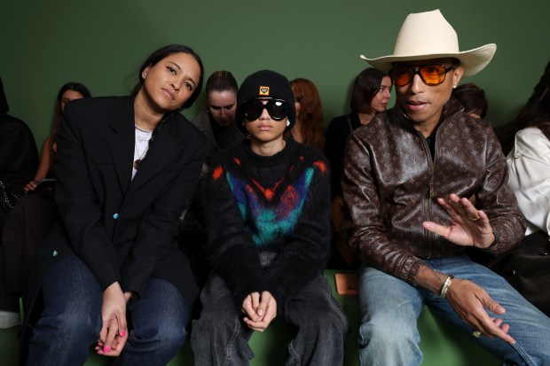 PARIS, FRANCE - MARCH 01: (L-R_ Helen Lasichanh, Rocket Williams and Pharrell Williams attend the Loewe Womenswear Fall/Winter 2024-2025 show as part of Paris Fashion Week on March 01, 2024 in Paris, France. (Photo by Pascal Le Segretain/Getty Images for Loewe)