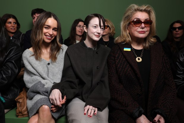 PARIS, FRANCE - MARCH 01: (L-R) Emilia Clarke, Andrea Riseborough and Catherine Deneuve attends the Loewe Womenswear Fall/Winter 2024-2025 show as part of Paris Fashion Week on March 01, 2024 in Paris, France. (Photo by Pascal Le Segretain/Getty Images for Loewe)