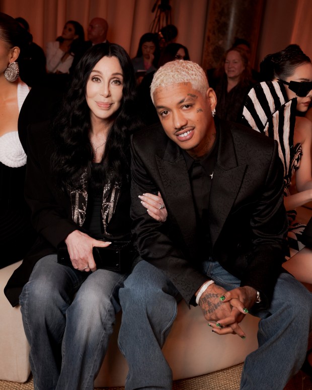 PARIS, FRANCE - FEBRUARY 28: Cher and Alexander Edwards attend the Balmain Womenswear Fall/Winter 2024-2025 show as part of Paris Fashion Week on February 28, 2024 in Paris, France. (Photo by Pierre Mouton/Getty Images for Balmain)