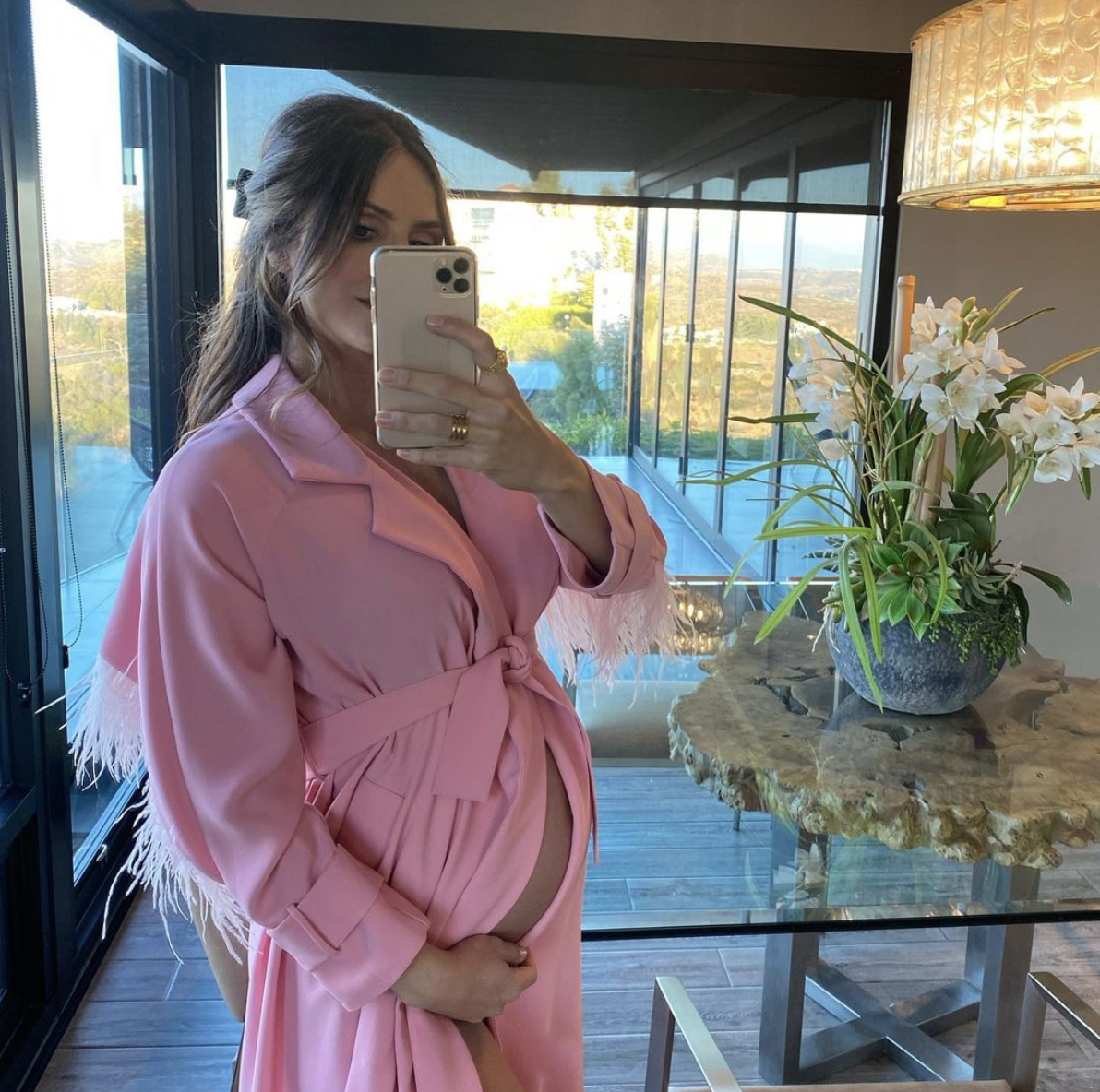 Katherine McPhee Foster snaps a selfie with her growing baby bump for Instagram on Tuesday, Jan. 19, 2021. The 36-year-old actress is expecting her first child with husband David Foster.