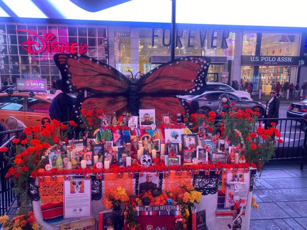 A Day of the Dead display is set up in Times Square on Thursday, Nov. 2, 2023. The altar, created by Justice For Migrant Women, pays tribute to the lost lives of migrant women and essential workers during the COVID-19 pandemic.