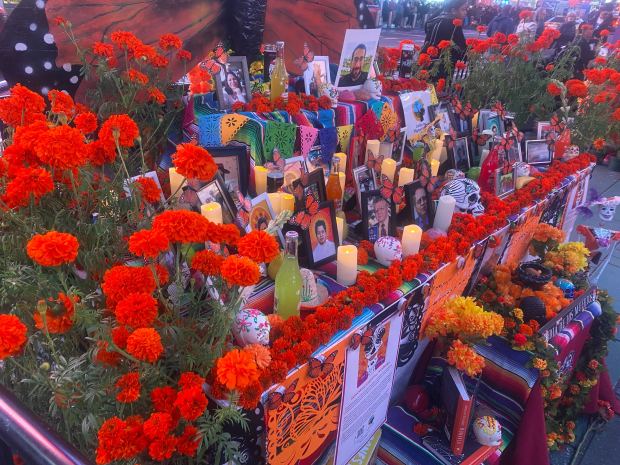 A Day of the Dead display is set up in Times Square on Thursday, Nov. 2, 2023. The altar, created by Justice For Migrant Women, pays tribute to the lost lives of migrant women and essential workers during the COVID-19 pandemic.
