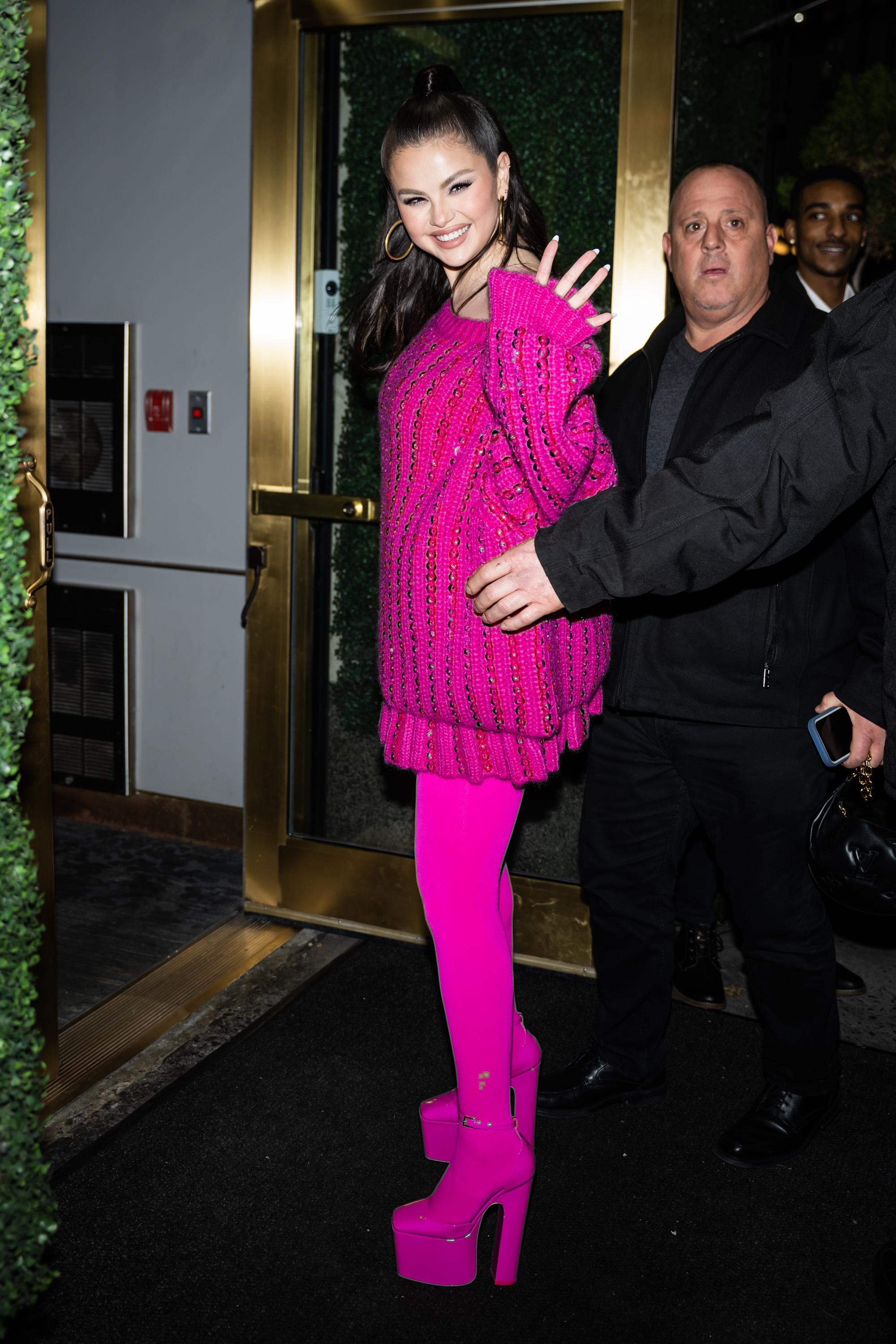 Selena Gomez is seen in Midtown on December 11, 2022 in New York City. Gomez in all electric pink outfit after making an 'Saturday Night Live' cameo appearance.