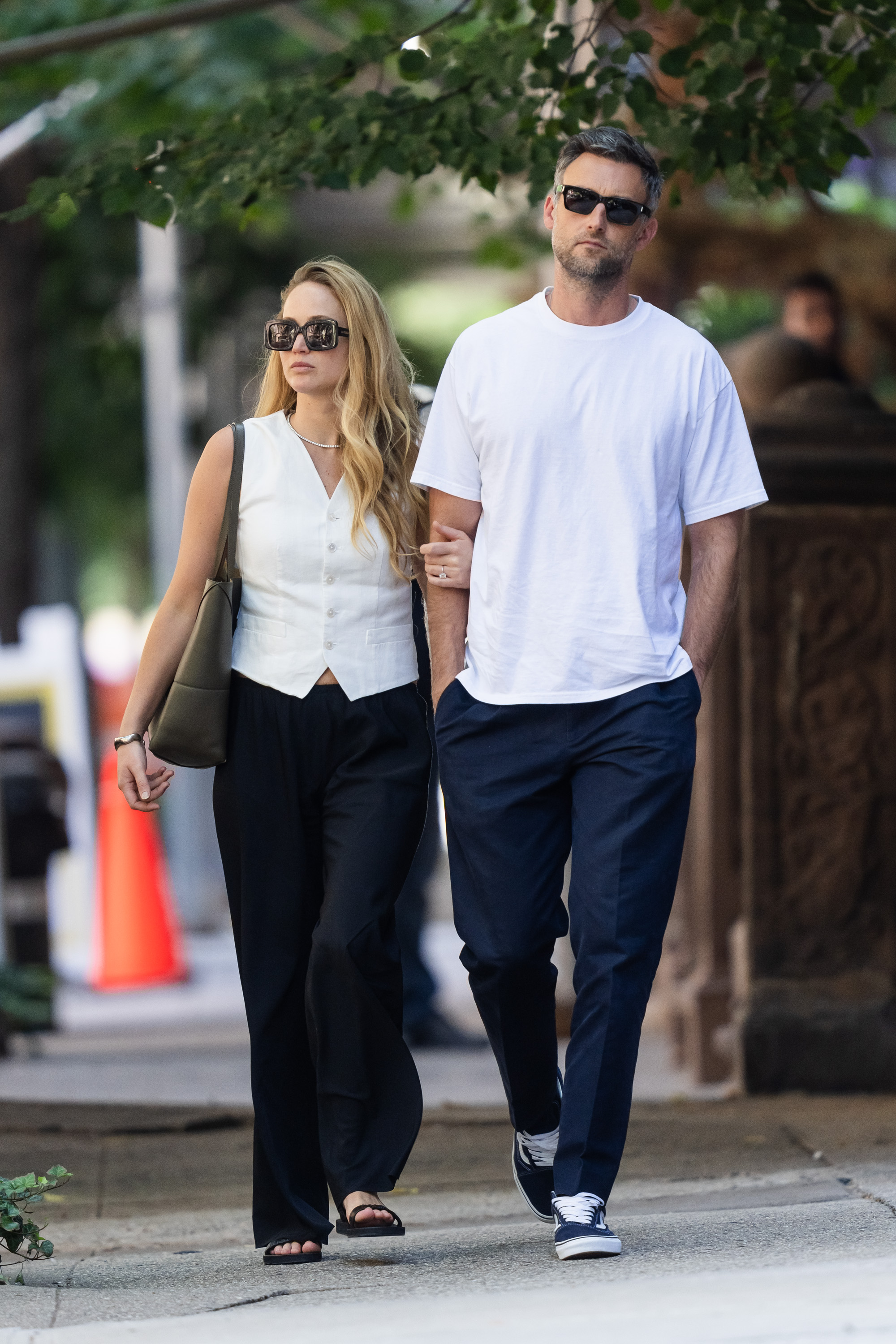 Jennifer Lawrence (L) and Cooke Maroney are seen in matching outfits out and about in the Upper West Side on Aug. 22, 2023, in New York City.