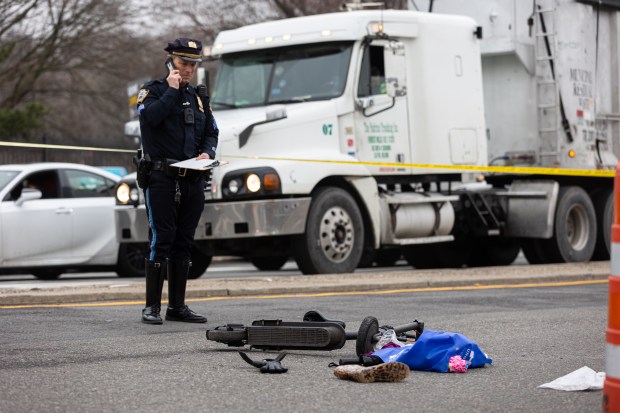 NYPD investigating the scene where a female electric scooter rider collided with a vehicle while crossing on the crosswalk on the corner of Blossom Ave and College Point Blvd., Queens, New York on Wednesday, Mar. 6, 2024. (Shawn Inglima for New York Daily News)