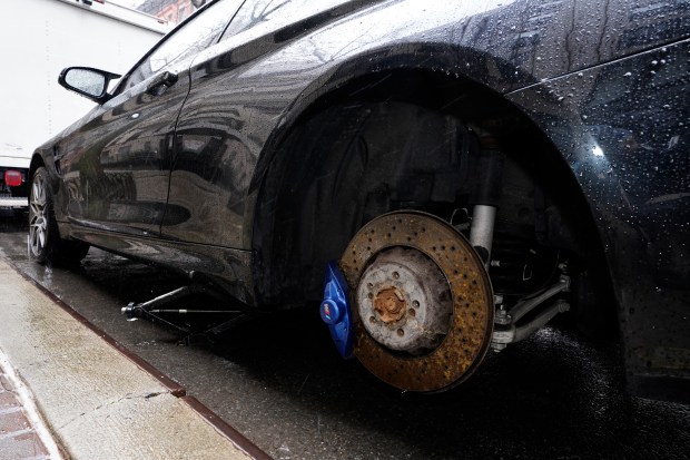 Gardner Conway's 2019 BMW M4 is pictured missing one competition rim Tuesday, March 5, 2024 in Manhattan, New York. Conway has had an expensive completion rim stolen from nearly the same spot in Oct. 2023. (Barry Williams for New York Daily News)
