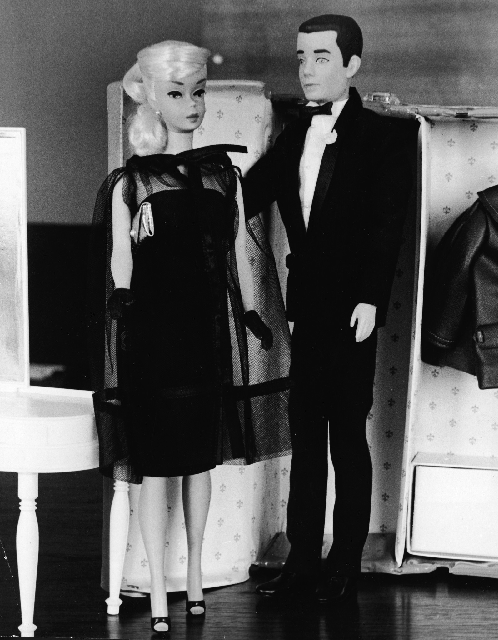 Formal wear Barbie & Ken are posed together in front of a toy closet on Dec. 15, 1964.