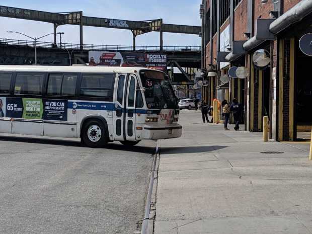 A bus pulls into the East New York bus depot.